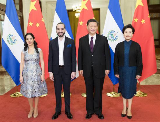 Chinese President Xi Jinping and his wife Peng Liyuan pose for photos with El Salvador's President Nayib Armando Bukele Ortez and his wife at the Great Hall of the People in Beijing, capital of China, Dec. 3, 2019. Chinese President Xi Jinping held talks with El Salvador's President Nayib Armando Bukele Ortez at the Great Hall of the People in Beijing on Tuesday. (Xinhua/Huang Jingwen)